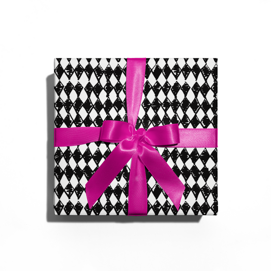 Gift box with black and white checkered pattern and pink ribbon on a white background
