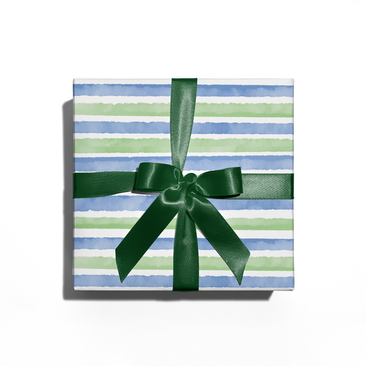 gift box with watercolor stripes wrapping paper and green bow