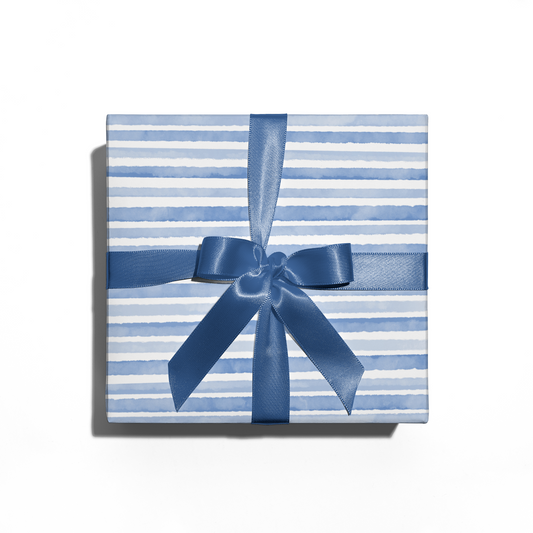 Gift box with blue and white stripes and a blue ribbon on a white background