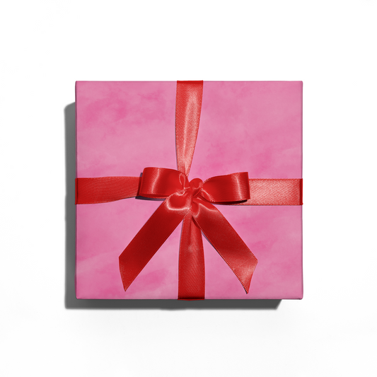 hot pink wrapping paper with a red bow